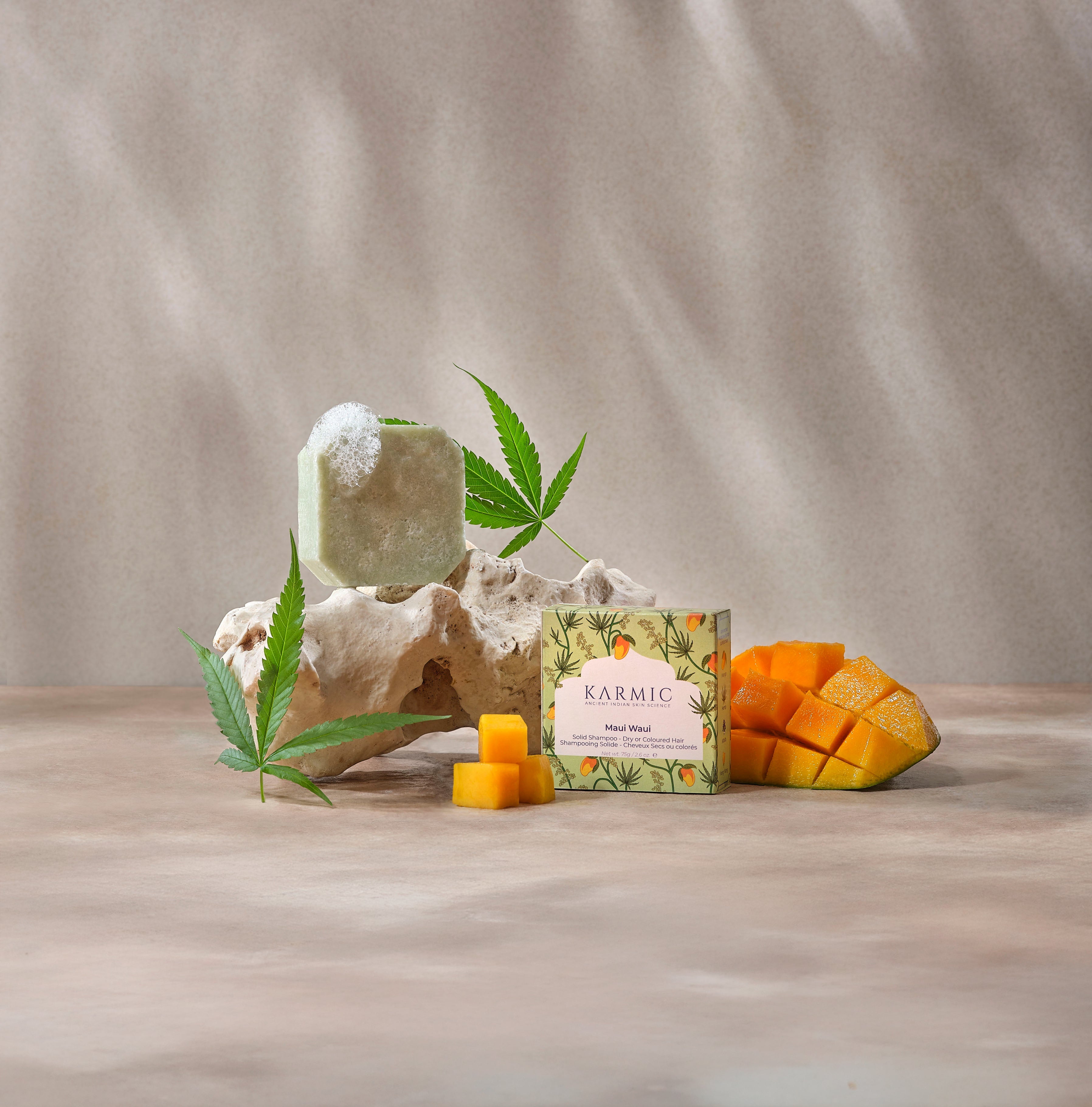 Conditioning shampoo bar with natural ingredients and hair care products on marble surface - eco-friendly hair care routine